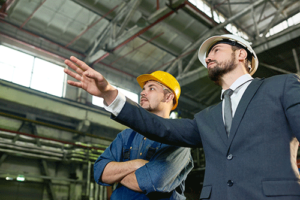 men in hard hats talk about equipment financing