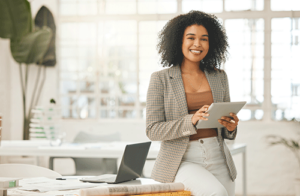 woman smiles while filling out a loan application for solvent funding